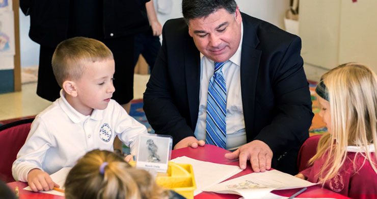 Dr. Cheeseman with students in classroom